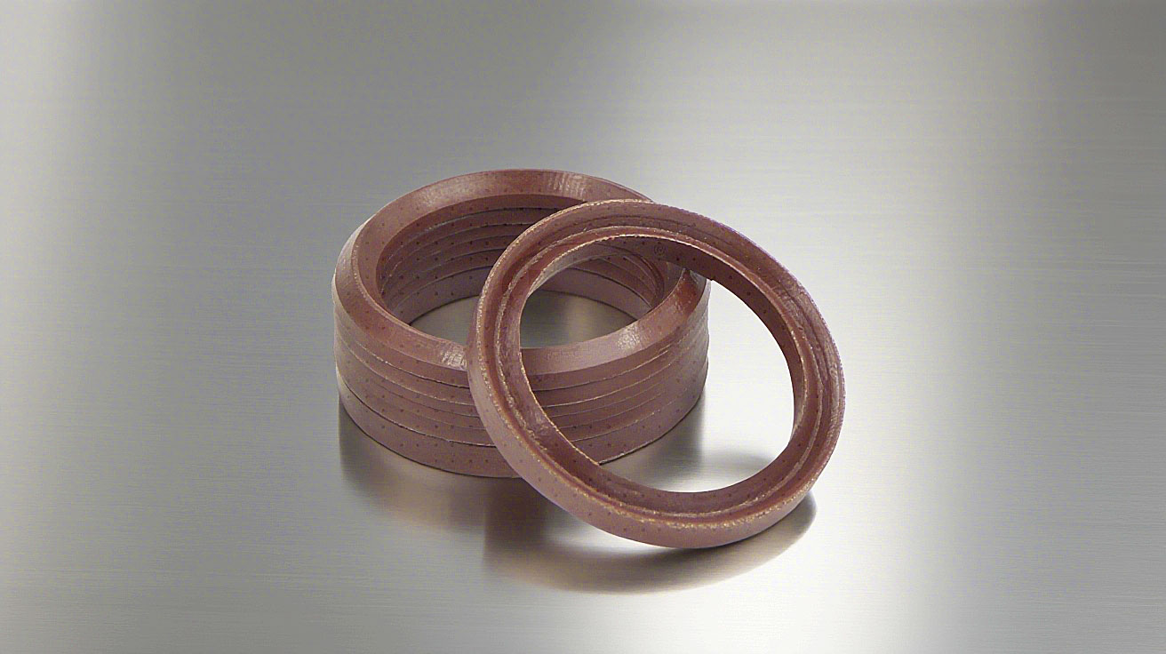 氟橡膠V型夾布油封---是由氟橡膠（FKM）+夾布密封材料制成的油封，主要應用于盾構機、冶金設備、陶瓷設備、重載油缸、油壓機等