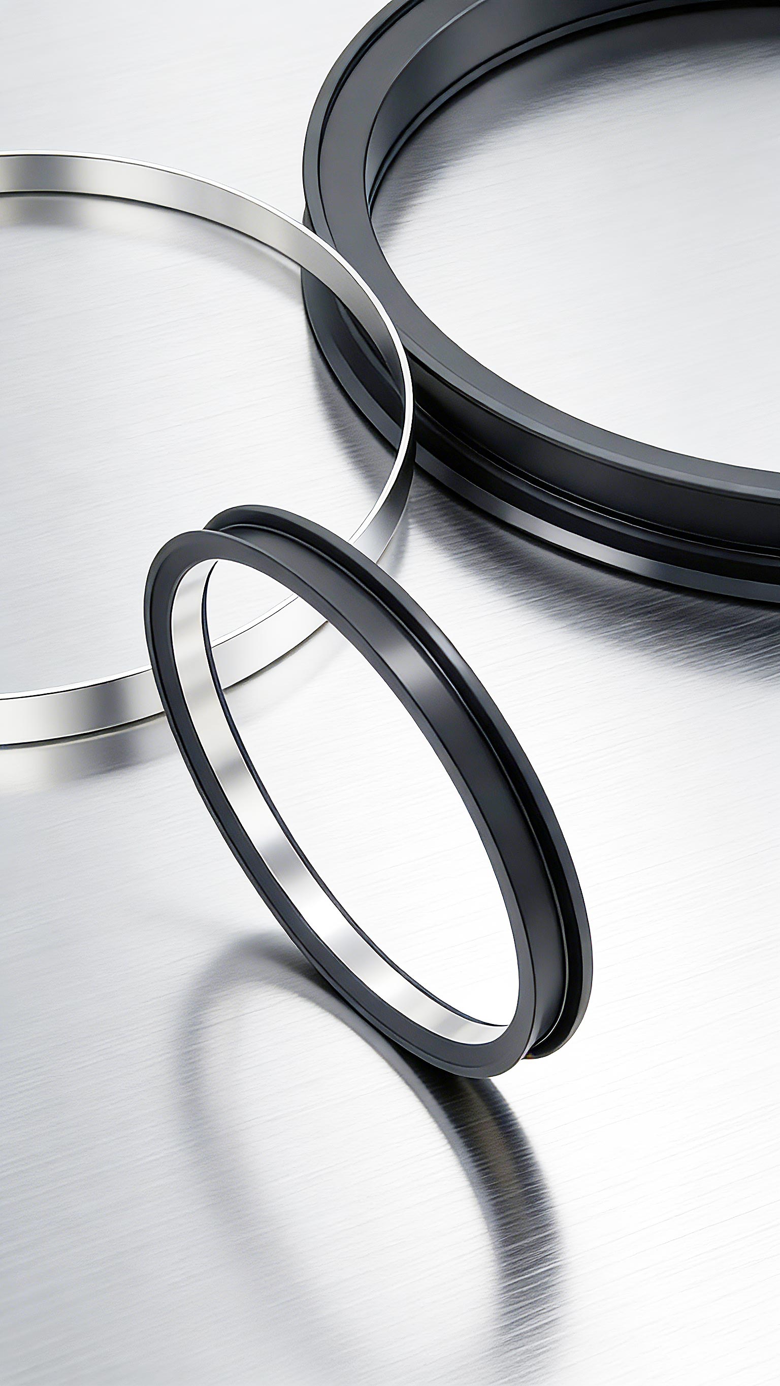 軋機(jī)速度超90米/秒，什么高線軋機(jī)密封件能扛??？ 高溫水汽油混合，密封易壞？選對(duì)高線軋機(jī)密封件？ 頻繁停機(jī)換密封？長(zhǎng)效型高線軋機(jī)密封件是關(guān)鍵? 在高速線材生產(chǎn)線上，軋輥軸承座的活塞桿正以90-100米/秒的驚人速度往復(fù)運(yùn)動(dòng)，這比高鐵速度還要快。在如此極端的高速摩擦下，普通橡膠密封件會(huì)迅速產(chǎn)生高溫，材料軟化磨損，通常數(shù)日內(nèi)即告失效，導(dǎo)致潤(rùn)滑油泄漏、冷卻水侵入。這直接造成軸承潤(rùn)滑不良，溫度飆升，最終引發(fā)昂貴的軸承燒毀事故，每次非計(jì)劃停機(jī)更換都意味著巨大的產(chǎn)量損失。專為這一嚴(yán)苛工況設(shè)計(jì)的高線軋機(jī)密封件，其核心采用了具有極低摩擦系數(shù)的聚四氟乙烯（PTFE）作為密封唇材料，輔以不銹鋼骨架提供強(qiáng)力支撐，從而在超高速度下仍能保持穩(wěn)定的密封性能和超長(zhǎng)使用壽命，是應(yīng)對(duì)高速挑戰(zhàn)的根本解決方案。  高溫蒸汽與冷卻水交織，密封件如何在“冰火兩重天”中不失效？ 高線軋機(jī)軸承座的工作環(huán)境異常復(fù)雜：內(nèi)部是超過110℃的高溫潤(rùn)滑油，外部則充斥著用于冷卻的軋制水和隨之產(chǎn)生的高溫水蒸氣。這種高溫、水汽與潤(rùn)滑油共存的惡劣工況，要求密封件材料必須同時(shí)具備卓越的耐高溫性、抗介質(zhì)性和尺寸穩(wěn)定性。傳統(tǒng)的丁腈橡膠（NBR）在此環(huán)境下極易硬化老化。而高線軋機(jī)密封件所使用的PTFE復(fù)合材料，天生憎水且化學(xué)性質(zhì)極其穩(wěn)定，能夠長(zhǎng)期耐受潤(rùn)滑油、水和蒸汽的混合侵蝕，在高溫下也不會(huì)發(fā)生顯著變形，確保密封界面始終嚴(yán)密，有效隔絕外部水汽侵入內(nèi)部油腔。  頻繁停機(jī)更換密封件，如何保障連續(xù)生產(chǎn)的效率和效益？ 對(duì)于追求連續(xù)化、高效率的現(xiàn)代化軋鋼生產(chǎn)線而言，設(shè)備可靠性就是生命線。軸承座密封的頻繁失效，導(dǎo)致的不僅僅是密封件本身的更換成本，更會(huì)連鎖引發(fā)軸承損壞、計(jì)劃外停機(jī)和寶貴的生產(chǎn)時(shí)間損失。一次計(jì)劃外停機(jī)可能造成每小時(shí)數(shù)萬元的產(chǎn)值損失。因此，選擇一款可靠的高線軋機(jī)密封件，實(shí)質(zhì)上是投資于整個(gè)生產(chǎn)線的穩(wěn)定性和綜合效益。它通過優(yōu)異的耐磨性和抗介質(zhì)能力，將維護(hù)周期從“按天計(jì)算”延長(zhǎng)至“按年計(jì)劃”，大幅提升了設(shè)備的平均無故障運(yùn)行時(shí)間。許多專注于工業(yè)密封領(lǐng)域的廣東密封件廠家，正是通過提供此類高性能定制化產(chǎn)品來幫助客戶實(shí)現(xiàn)降本增效。  國(guó)產(chǎn)高性能密封解決方案，助力中國(guó)制造業(yè)升級(jí)。 面對(duì)高速線材生產(chǎn)線對(duì)密封件越來越苛刻的要求，國(guó)內(nèi)密封行業(yè)正在積極迎戰(zhàn)。本土制造商不僅需要提供高質(zhì)量的產(chǎn)品，更需要對(duì)軋鋼工藝有深入的理解，才能設(shè)計(jì)出真正貼合工況的密封方案。一些技術(shù)領(lǐng)先的廣東密封件廠家已經(jīng)在此領(lǐng)域積累了豐富的經(jīng)驗(yàn)。例如，廣東東晟密封件廠家等企業(yè)，能夠針對(duì)不同軋機(jī)型號(hào)和具體工況，提供從材料配方、結(jié)構(gòu)設(shè)計(jì)到安裝指導(dǎo)的全套解決方案。國(guó)產(chǎn)高性能高線軋機(jī)密封件的成熟與應(yīng)用，正在逐步打破國(guó)外品牌在此領(lǐng)域的壟斷，以可靠的性能和更優(yōu)的性價(jià)比，為中國(guó)制造業(yè)的裝備升級(jí)與成本控制提供有力支撐。  一、性能測(cè)試標(biāo)準(zhǔn) GB/T 32217-2015《#液壓傳動(dòng)密封裝置評(píng)定液壓往復(fù)運(yùn)動(dòng)密封件性能的試驗(yàn)方法》 現(xiàn)行國(guó)家標(biāo)準(zhǔn)，專門用于評(píng)定往復(fù)運(yùn)動(dòng)密封件的性能。 為您文章中所有關(guān)于密封性能、可靠性的論述提供了國(guó)家標(biāo)準(zhǔn)級(jí)的、可驗(yàn)證的測(cè)試方法依據(jù)。   二、行業(yè)應(yīng)用與改造案例 《#高線軋機(jī)初中軋軸承座密封系統(tǒng)改造》（《#潤(rùn)滑與密封》） 行業(yè)核心期刊文章，分析了與您文中描述完全一致的實(shí)際工況問題。